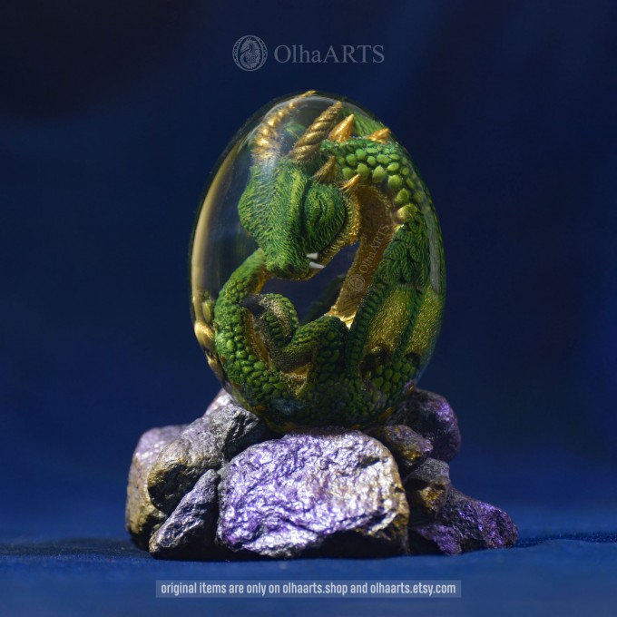 Red-gold Spiral-horned Dragon Egg. VIP Gift Set with a spiral-horned baby dragon in epoxy resin egg
