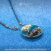 Pendant with Swimming Otters