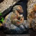 Tyrannosaurus Rex baby with its stone nest