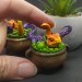 Mini figurine with a little dragon in a witch's cauldron