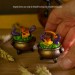 Mini figurine with a little dragon in a witch's cauldron